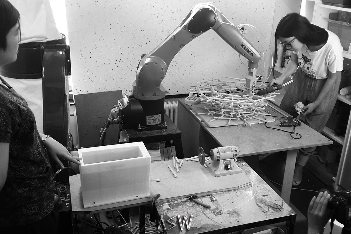 Students work with robot