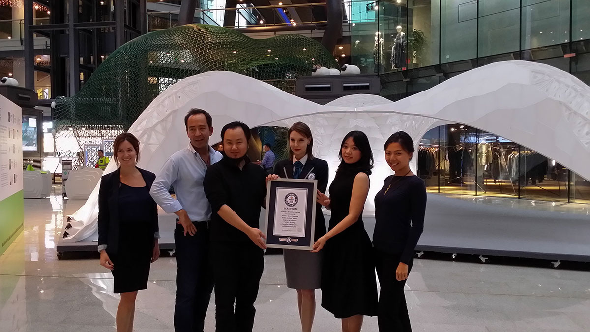 Guinness official in fromt of the Vulcan Pavilion with Parkveiw Green staff and Dr. Yu Lei