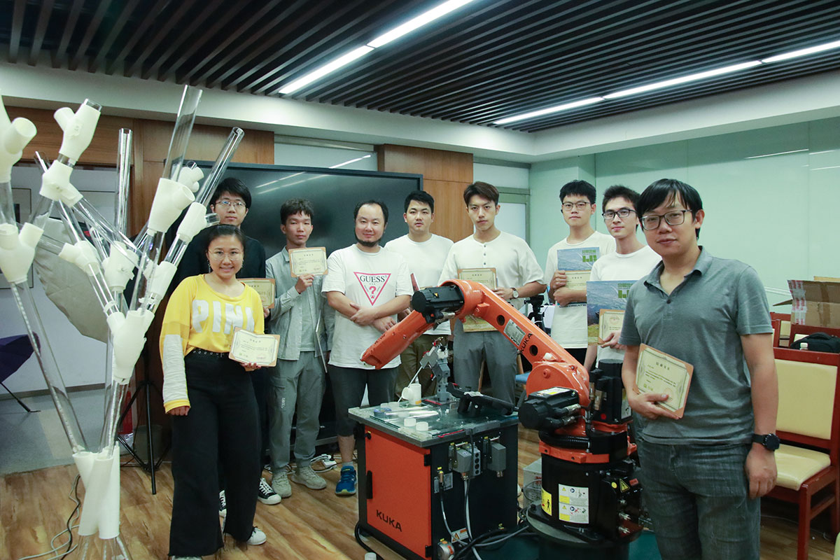 Group students' photo in front of the final installation