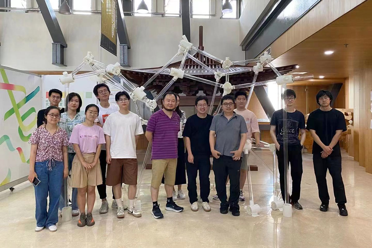 Group students' photo in front of the final installation