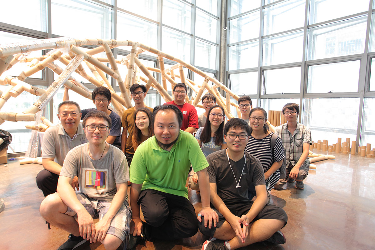 Students and instructor in front of the Wood Bridge